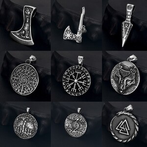 May include: Nine silver pendants featuring a variety of Viking symbols and designs. The pendants include an axe, a compass, a wolf, a tree of life, and a valknut.
