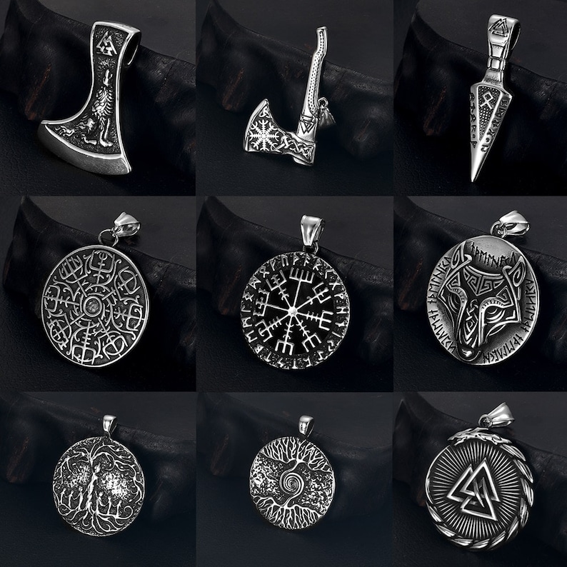May include: Nine silver pendants featuring a variety of Viking symbols and designs. The pendants include an axe, a compass, a wolf, a tree of life, and a valknut.