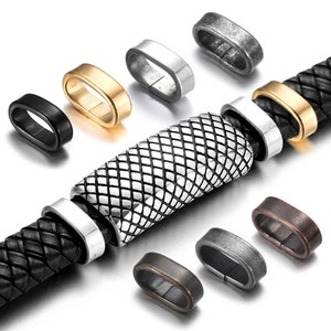 Puede incluir: Surtido de cierres de pulsera de metal en varios acabados, incluyendo negro, plata, oro, plata antigua y cobre. Los cierres son de forma ovalada con cierre de resorte. También se muestra una pulsera de cuero trenzado con una cuenta de metal.