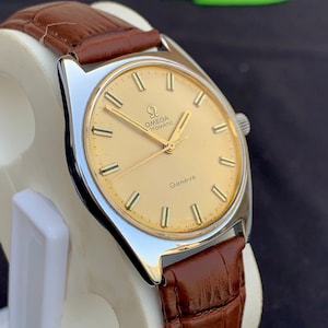 Vintage Omega Geneve, Automatic English made Dennison Stainless case for Omega leather Strap
