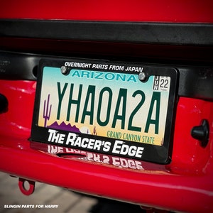 Racer’s Edge “Overnight Parts From Japan” Shop License Plate Frame
