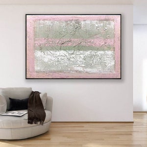 May include: Abstract painting with a textured white, gray, and green background. The painting has a pink border and two pink horizontal stripes.