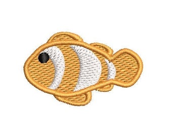 May include: An orange and white cartoon clownfish with a black eye. The fish is embroidered with a detailed design.