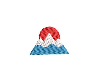 May include: A simple embroidery design of a mountain range with a red sun setting behind it. The mountain is blue and white, with a white peak.
