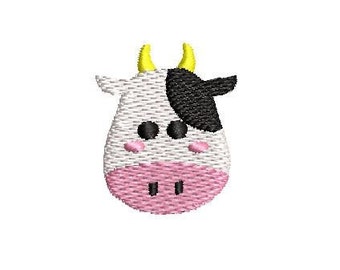 May include: A cartoon cow face with black and white spots, pink cheeks, and yellow horns. The cow is smiling.