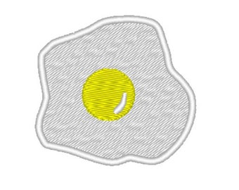 May include: White embroidered patch shaped like a fried egg with a yellow yolk.
