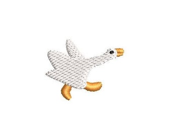 May include: White goose with orange feet flying with wings spread out.