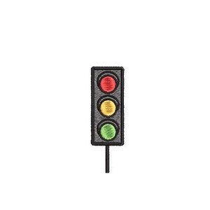 Puede incluir: Un semáforo con una luz roja en la parte superior, una luz amarilla en el medio y una luz verde en la parte inferior.