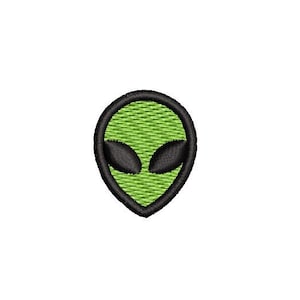 May include: Green alien head with black eyes, outlined in black. The alien head is a simple cartoon design.
