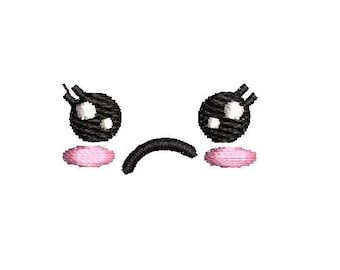 May include: Embroidered sad face design featuring two black eyes with white highlights, pink blush, and a curved black mouth. The design is on a white background. This design is suitable for patches, stickers, or other crafts.
