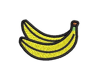 May include: Embroidered patch featuring two yellow bananas with black outlines. The bananas have a textured appearance, with detailed stitching. The patch is designed to be ironed on or sewn onto fabric.