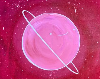 May include: A pink planet with a white ring around it, set against a red background with white stars.