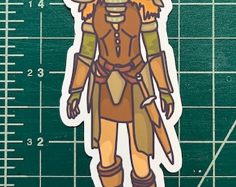 May include: A sticker of a cartoon woman warrior wearing brown armor, a brown skirt, and brown boots. She has long red hair and a green face paint design.