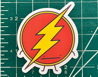 May include: A red and yellow cartoon sticker of the Flash superhero logo with a lightning bolt and a simple face. The sticker has a white outline and small legs.