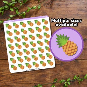 May include: Sheet of pineapple stickers with a repeating pattern of orange and green pineapples. A purple circle with a pineapple graphic is on the right. Text reads "Multiple sizes available!" and "somethingpeaceful.com".