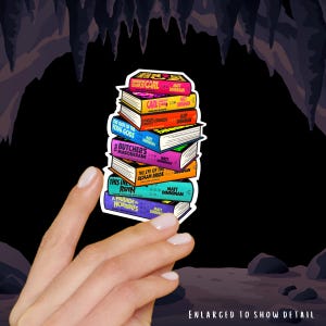 May include: A sticker featuring a vertical stack of colorful books by Matt Dinniman, including titles like Dungeon Crawler Carl, The Gate of the Feral Gods, The Butcher's Masquerade, The Eye of the Bedlam Bride, This Is How You Lose the Time War, and A Parade of Horribles.