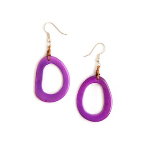 May include: A pair of purple oval-shaped earrings with a brown leather cord and silver hooks.
