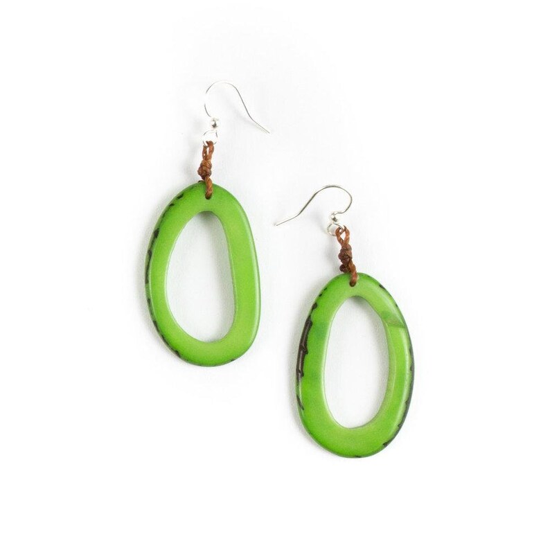 May include: A pair of green oval earrings with a brown leather cord and silver hooks.