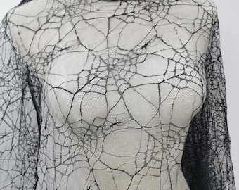 Tissu toile d'araignée en dentelle noire : matériau pour déguisement d'Halloween