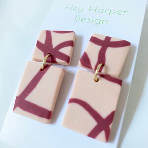 Magenta and cream abstract patterned dangle earring