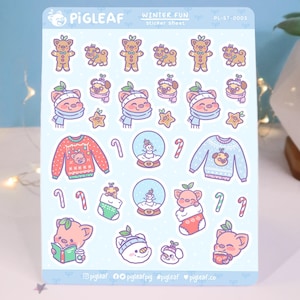 May include: A sticker sheet with a winter theme featuring cute pig illustrations. The sheet includes images of pigs wearing winter clothes, holding candy canes, and enjoying winter activities. The text "WINTER FUN sticker sheet" and "PL-ST-0003" are printed on the sheet.