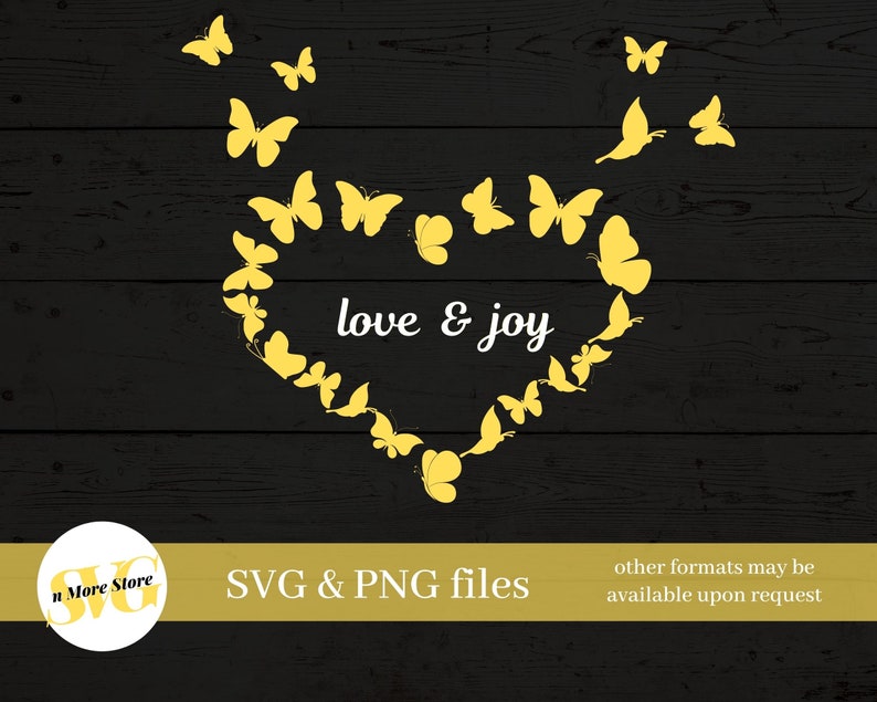 May include: A yellow heart shape made of butterflies with the text "love & joy" inside. The butterflies are on a black wood background.