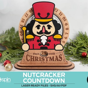 May include: A wooden Christmas countdown decoration featuring a cartoon nutcracker soldier. The nutcracker is in a red uniform with a black mustache and a gold scepter. The countdown reads "25 days until Christmas". The text "Nutcracker Countdown" is below.