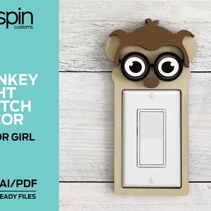 May include: A wooden monkey-shaped light switch cover with a light switch in the center. The monkey has brown ears and a face with black-rimmed glasses. Text on the left reads "MONKEY LIGHT SWITCH DECOR BOY OR GIRL SVG/AI/PDF LASER READY FILES."
