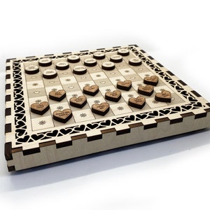May include: A wooden game board with a checkerboard pattern and a heart-shaped border. The board is decorated with small wooden hearts, each with a different message on it. The messages include "Make Me Smile", "Kiss Me", "Hug Me", and "I Love You".