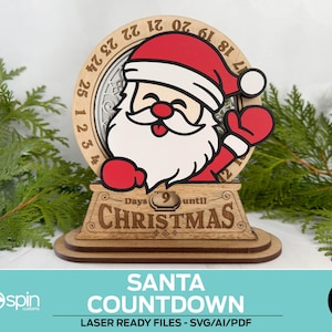 May include: A wooden Santa countdown calendar with a red and white Santa Claus design. The calendar shows "9 days until Christmas" and has a circular dial with numbers. The base has the text "SANTA COUNTDOWN".