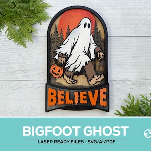 May include: A layered wooden wall art piece featuring a brown Bigfoot creature wearing a white ghost sheet and carrying an orange jack-o'-lantern. The background shows a red moon and black forest silhouettes. The word BELIEVE is in orange text.