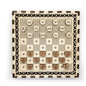 May include: A wooden game board with a checkered pattern and hearts around the edge. The board has small wooden hearts with phrases like "Kiss Neck", "Slow Dance", and "Say I Love You" on them.
