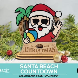 May include: A wooden Santa Beach Countdown decoration. Santa Claus is wearing a red shirt and hat, sunglasses, and holding a beach ball. The countdown reads "25 Days until Christmas". The text "SANTA BEACH COUNTDOWN" is at the bottom.