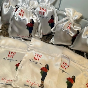 May include: White satin drawstring bags with the text "Tini Bit Hungover" in red and black. Each bag features an illustration of a woman holding red roses and the text "Kayla's 33rd Birthday".
