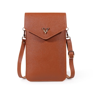 May include: A brown leather crossbody phone bag with a gold deer head accent. The bag has a flap closure and a long adjustable strap.