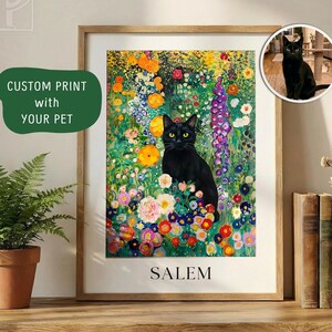 May include: A framed art print featuring a black cat with yellow eyes amidst a vibrant floral garden. The artwork includes the text "SALEM" at the bottom and a green banner that says "CUSTOM PRINT with YOUR PET". The print is displayed on a wooden surface.