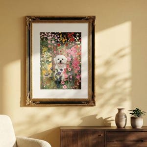 May include: Framed art print featuring a white dog in a colorful flower garden. The artwork is displayed in a gold and black ornate frame. The print showcases a variety of pink, red, yellow, and green flowers, creating a vibrant and cheerful scene.