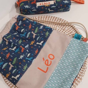 Trousse avec prénom dino bleu