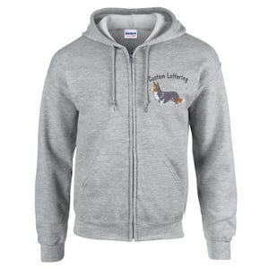 May include: A gray zippered hoodie with a cartoon image of a Cardigan Welsh Corgi and the text "Custom Lettering" on the front.