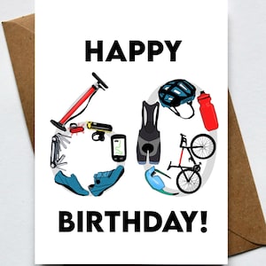 May include: A white birthday card with the words "HAPPY BIRTHDAY!" in black. The number 60 is formed with cycling gear illustrations, including a bike, helmet, shoes, and water bottle. The card is inside a brown envelope.