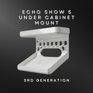 May include: White 3D printed mount for an Echo Show 5, 3rd generation, designed to be mounted under a cabinet. The mount has a honeycomb pattern and a shelf for the device.