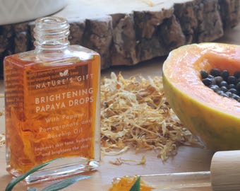 Uppljusande papaya-ansiktsolja med ekologisk nypon, granatäpplejojobaolja och morotsfröolja - Naturlig hudvård