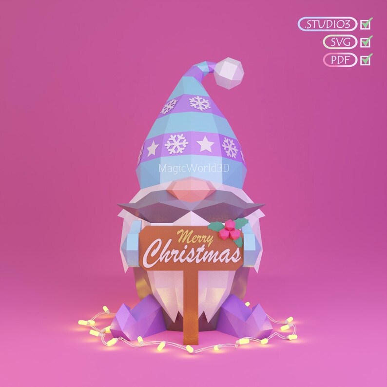 May include: A geometric Christmas gnome with a blue and purple hat, holding a sign that says "Merry Christmas." The gnome has a white beard and mustache, with a string of lights at its feet. The background is pink.