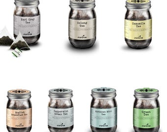 May include: Assortment of ten glass jars filled with loose leaf tea. The jars have silver lids and labels with the names of the teas: Earl Grey Tea, Oolong Tea, Camomile Tea, English Breakfast Tea, Peppermint Green Tea, Moroccan Mint Tea, and Green Tea. The labels are in a vintage style with a brown background and white text.