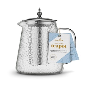 May include: A clear glass teapot with a hammered texture, stainless steel infuser, and a silver lid. The teapot has a capacity of 900ml, or 3.8 cups, and includes a tag that reads "charbrew teapot".