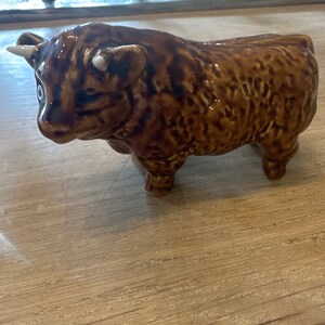 Bull figurine with white horns