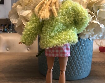 Barbie doll fully dressed with shift dress, boucle lime green coat. Yellow sandals.