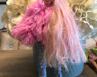 Festival Barbie fully dressed with star trousers, winged boots , lure. T-shirt and pink fluffy coat