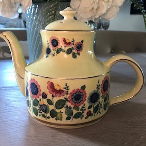 Stunning Arthur Wood tea pot in bright yellow surrounded by bright flowers stylish design with gilt edging