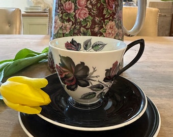 Royal Albert black floral design named Masquerade trio in very  good condition lovely vintage collectable cup saucer and side plate